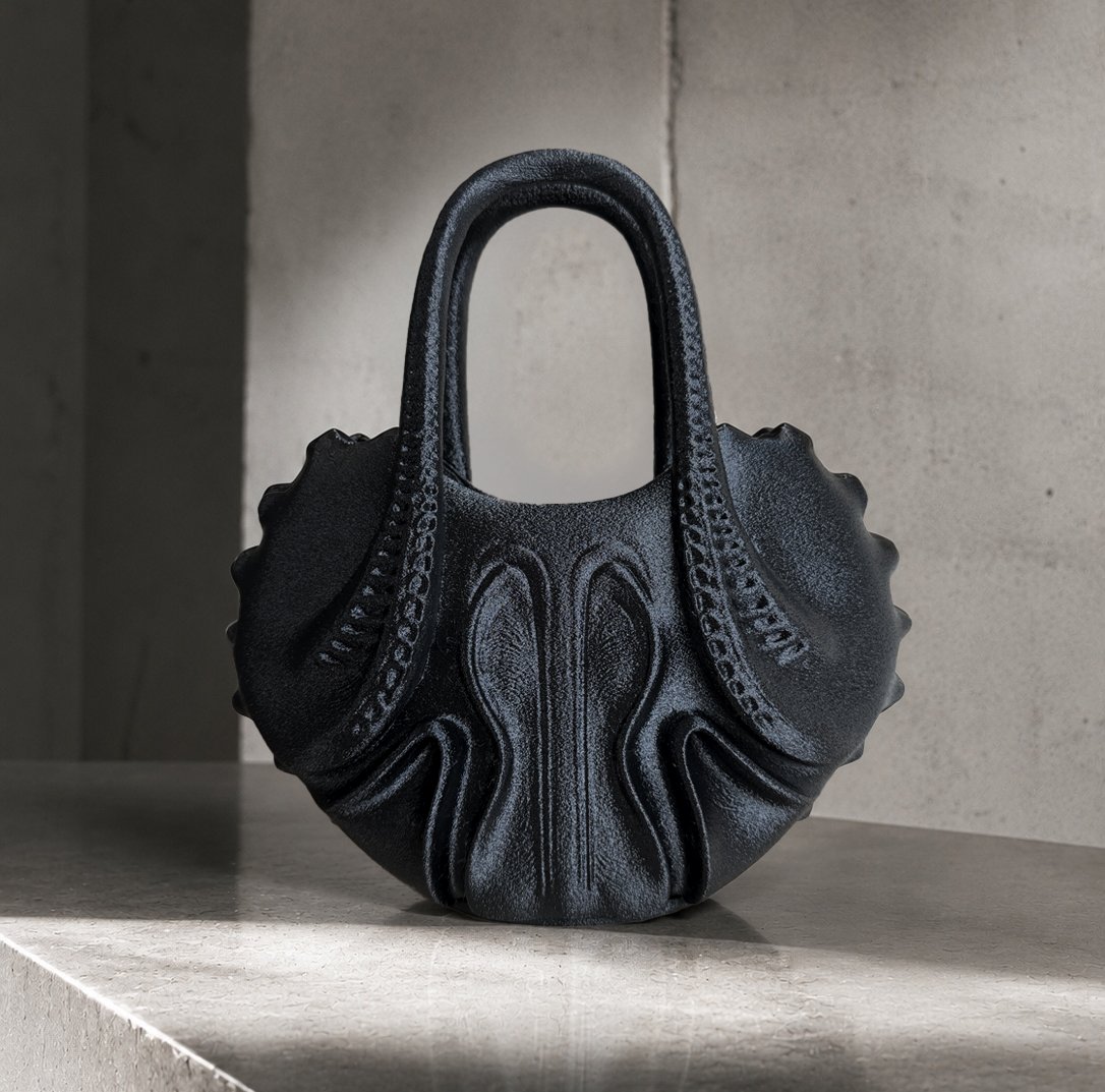 OCTAVE: compact biomorphic black handbag